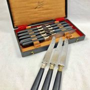 12 antique large table knives with ebony handles from the Napoleonic III period.