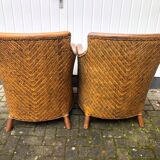 2 colonial armchairs in wood, rattan and leather, 1950s