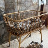 Rattan cradle with arrow