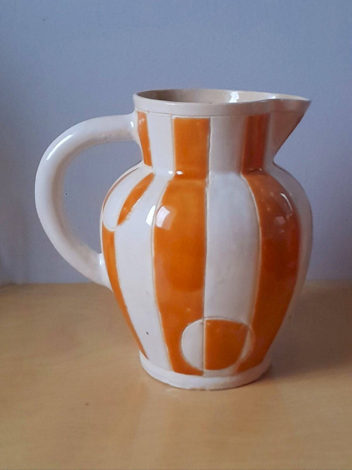 Old enamelled ceramic jug