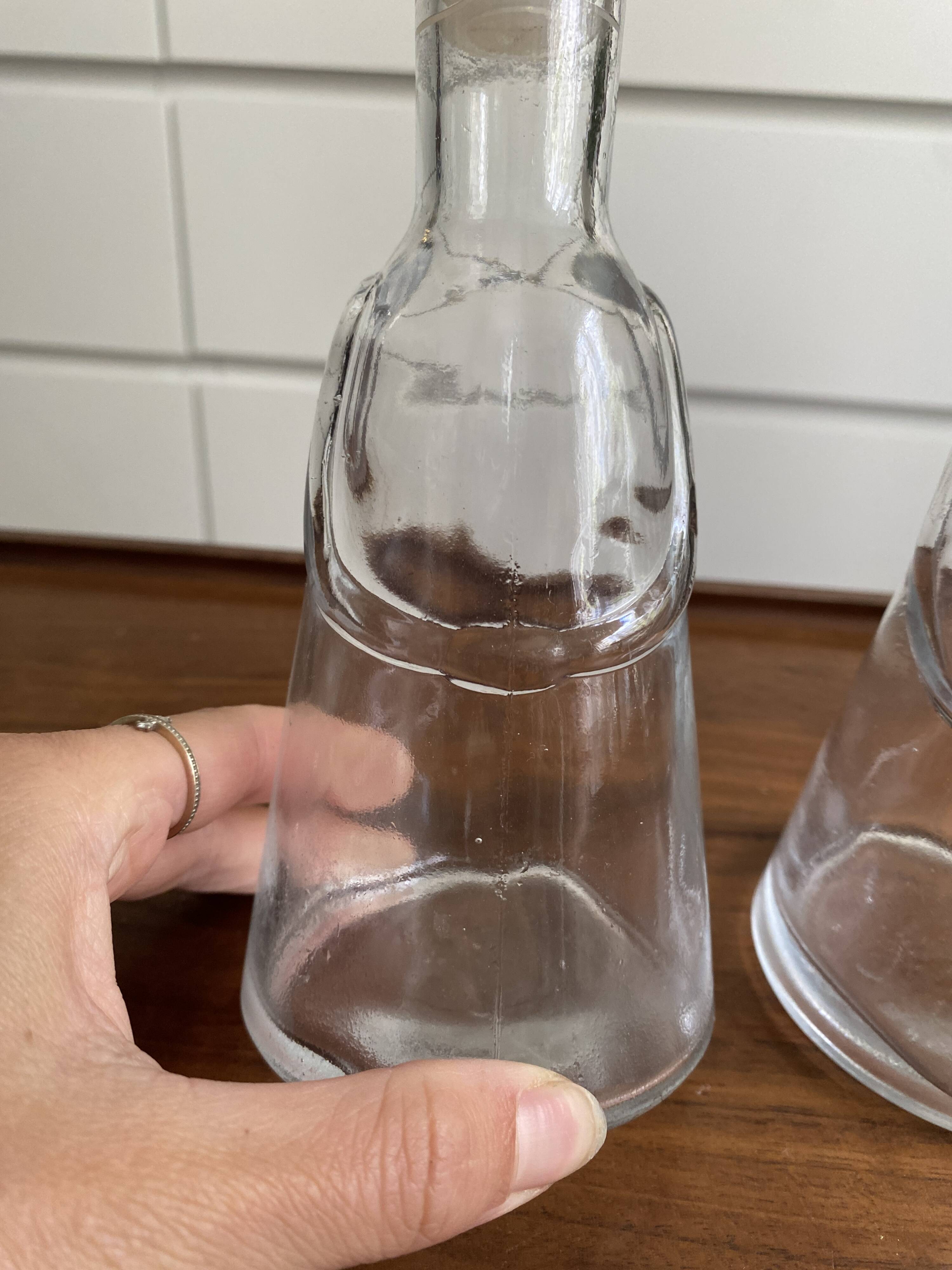 Pair of decanters by Erik Hoglund for Neiman Marcus, "People" series, Kosta Boda