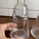Pair of decanters by Erik Hoglund for Neiman Marcus, "People" series, Kosta Boda