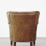 Fauteuil en cuir subtil avec coussin d'assise réversible en kilim