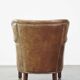 Fauteuil en cuir subtil avec coussin d'assise réversible en kilim