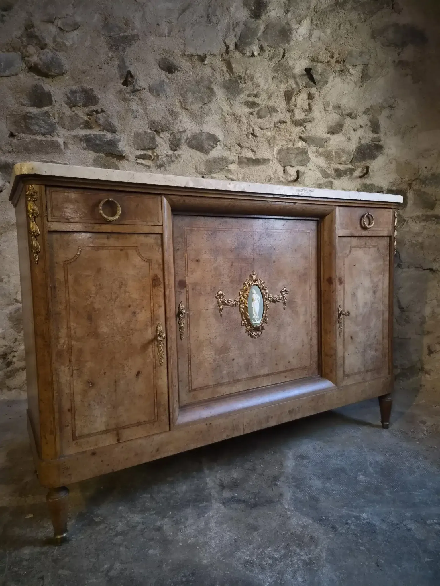 Antique Louis XVI style buffet in burr elm with marble top, late 19th century.