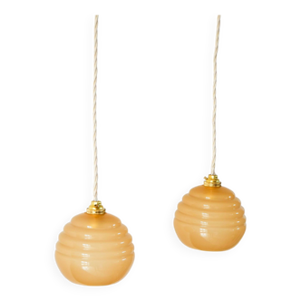 Pair of beige spiral model ball pendants 1960