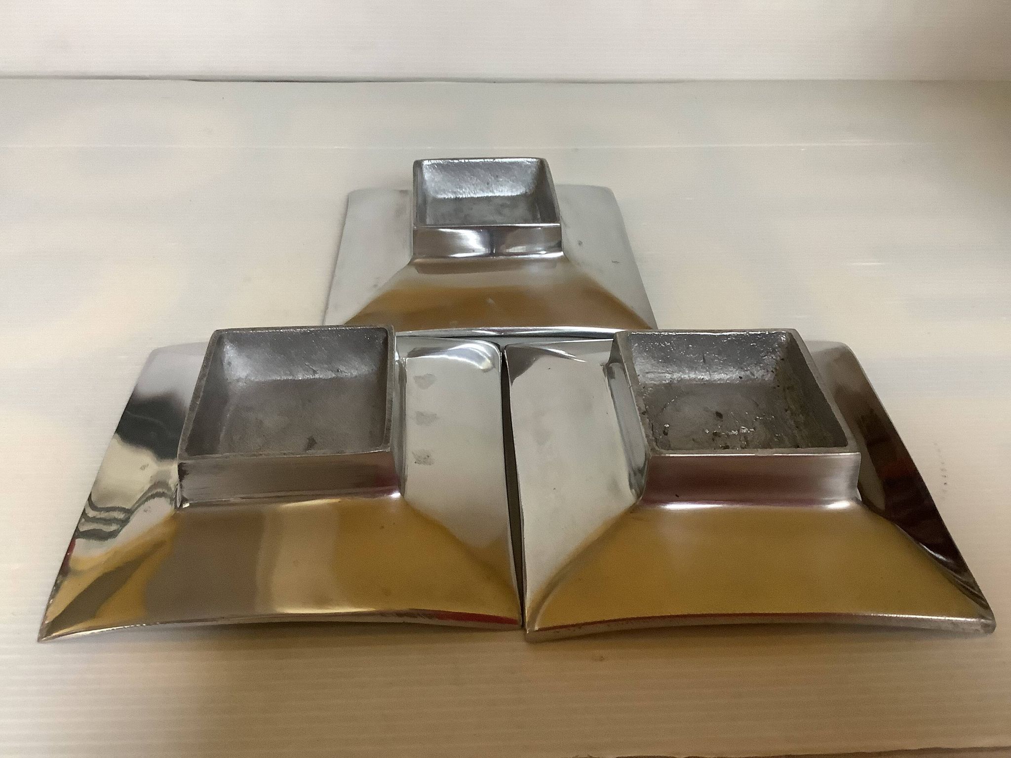 Three silver-plated metal trinket trays/candle holders