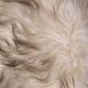 Danish Mid-century Modern stool reupholstered in white and black sheep skin