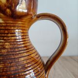 Orange glazed ceramic pitcher