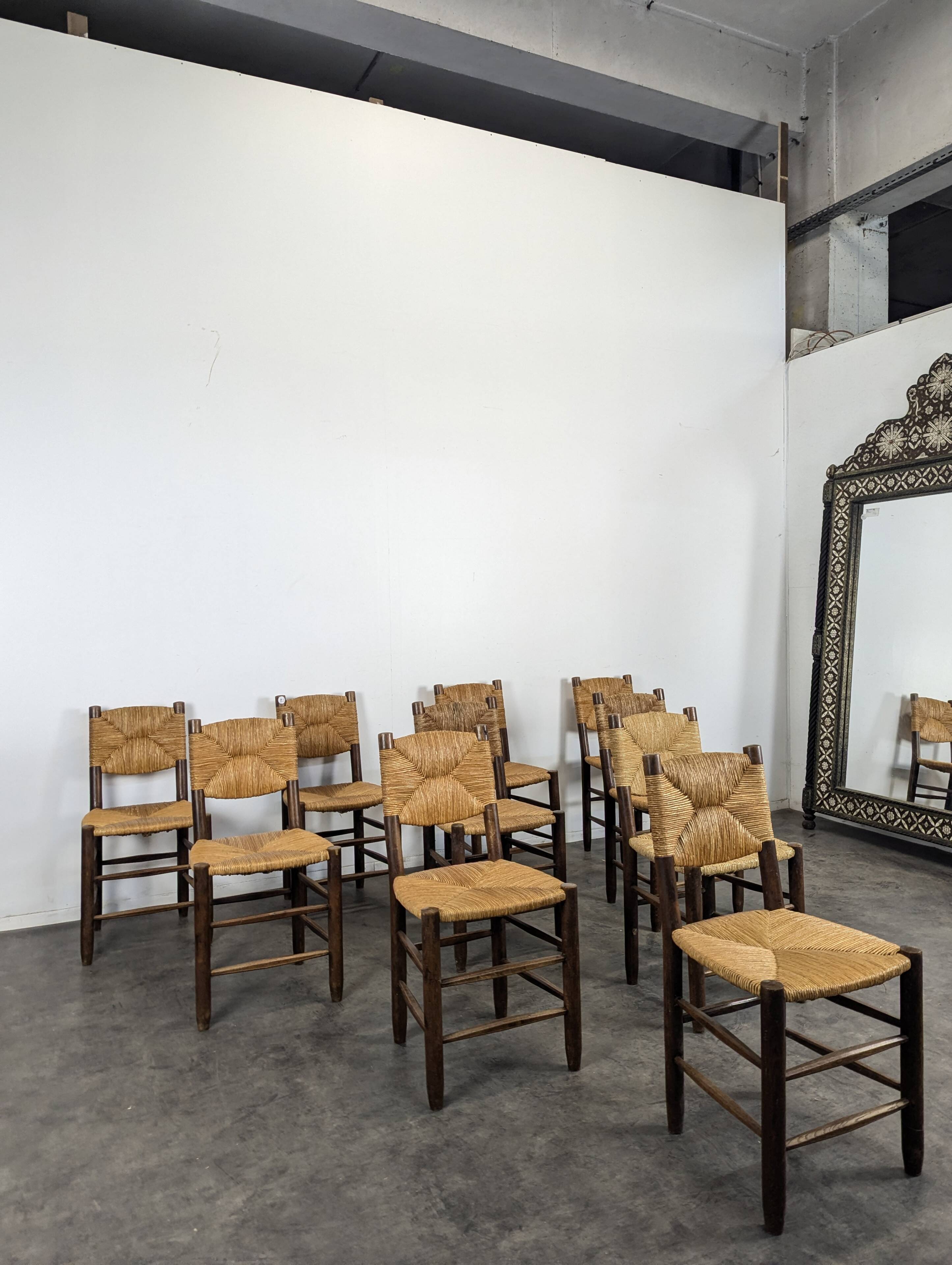 Série de 10 chaises modèle Bauche par Charlotte Perriand, circa 1960