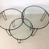 Set of three coffee tables black glass in the middle of the century with legs and metal hairpin
