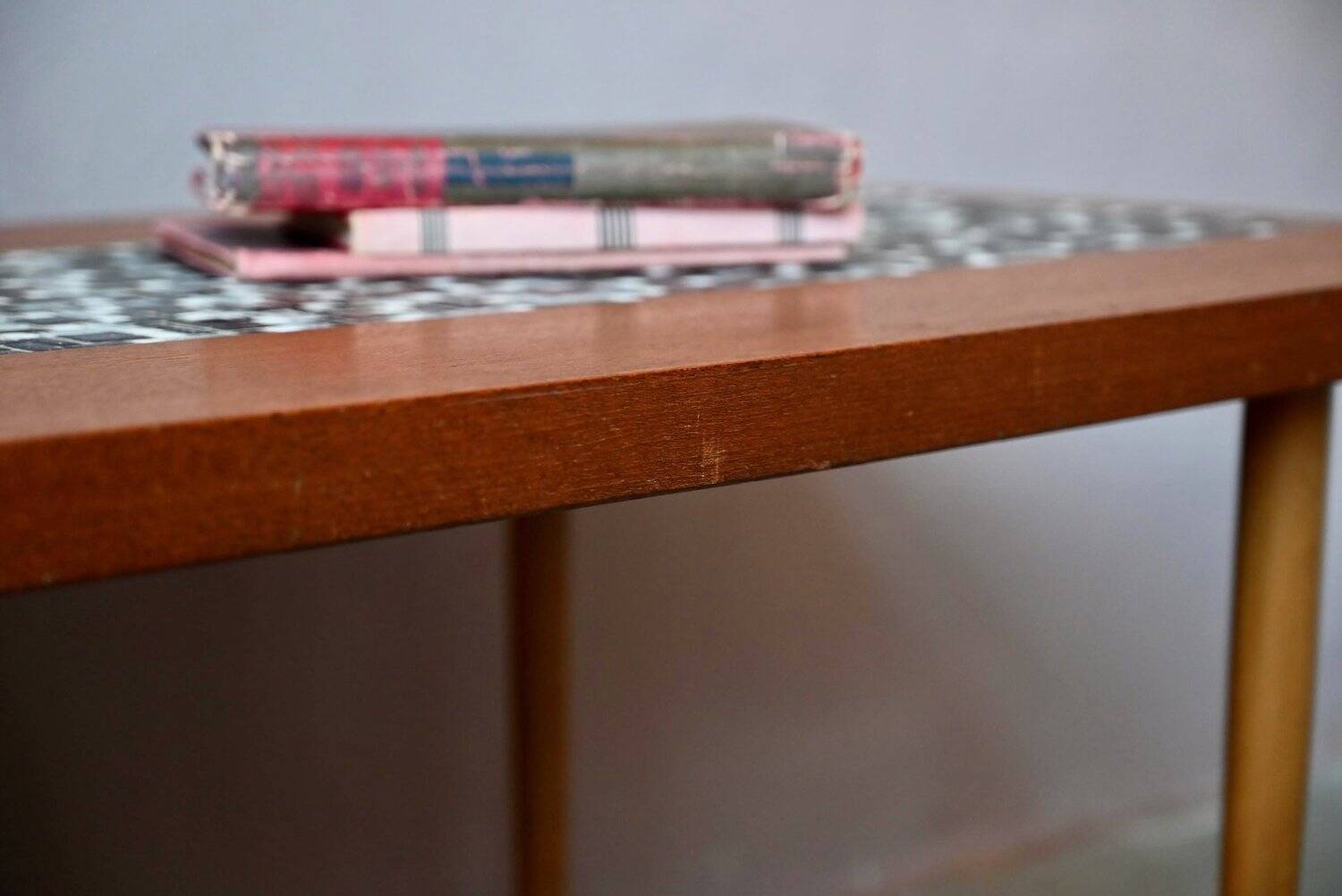 1970s coffee table with a tapered teak base and ceramic mosaic.