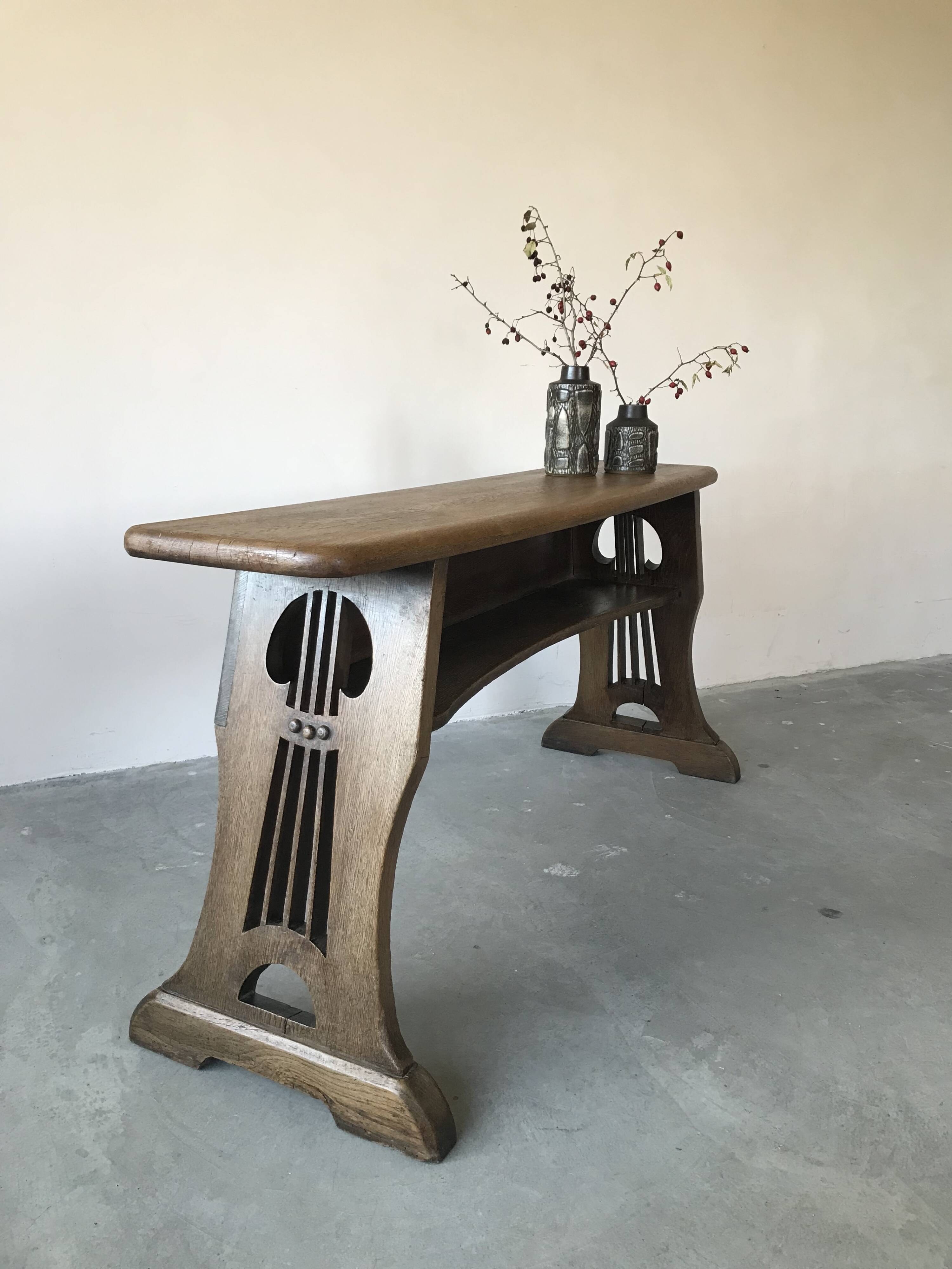 Art and Crafts style organ bench in solid oak.