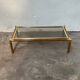 Gold metal coffee table with elm burl imitation.