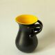 Two-handled vase, black and yellow glazed, in the style of Pol Chambost.
