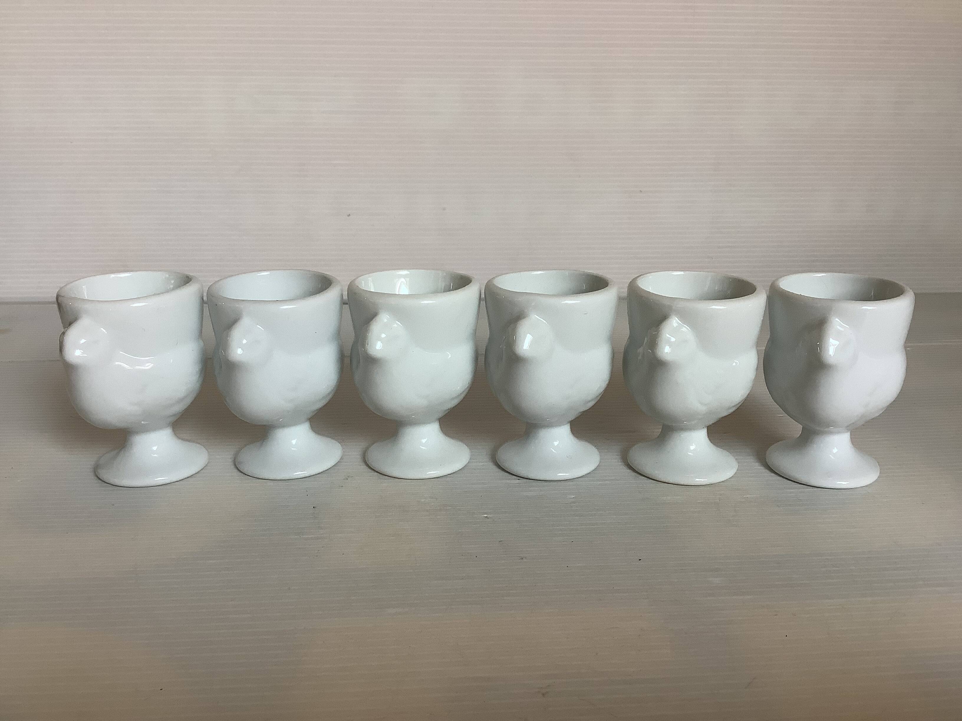 Six white hen egg cups