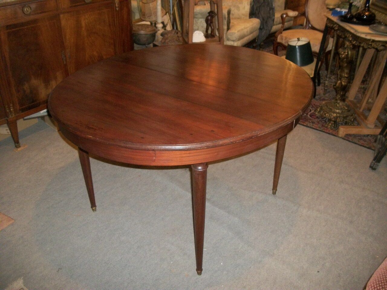 Oval mahogany table with extension cords