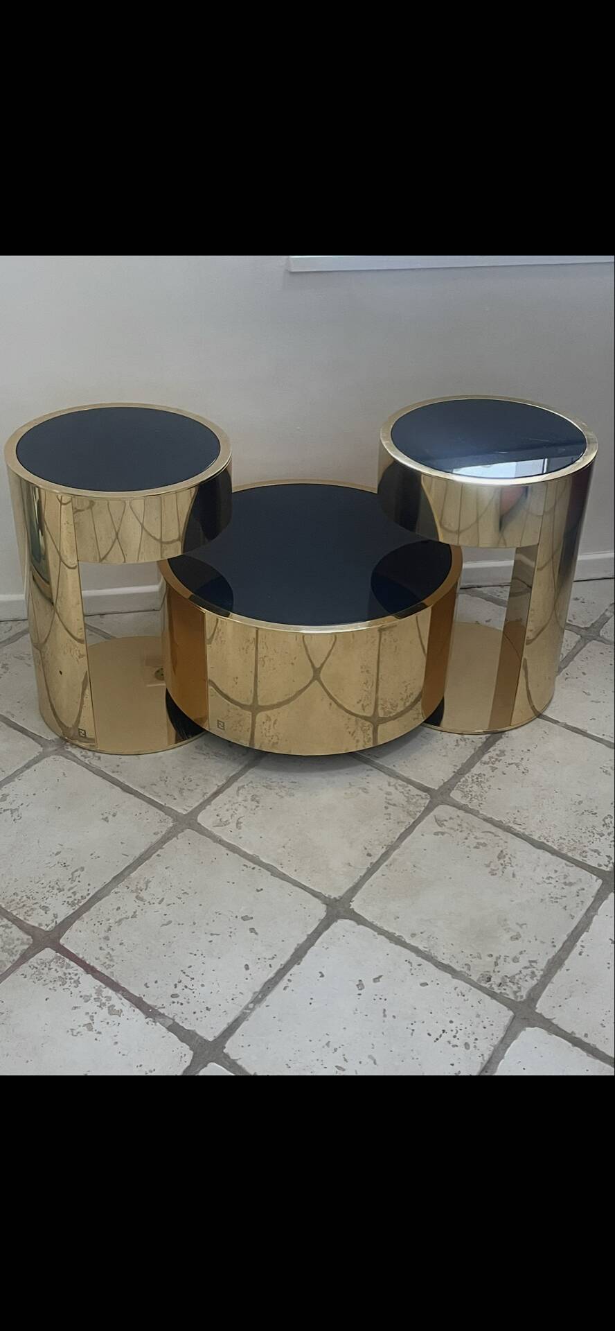 2 bedside tables and a brass Fendi table.