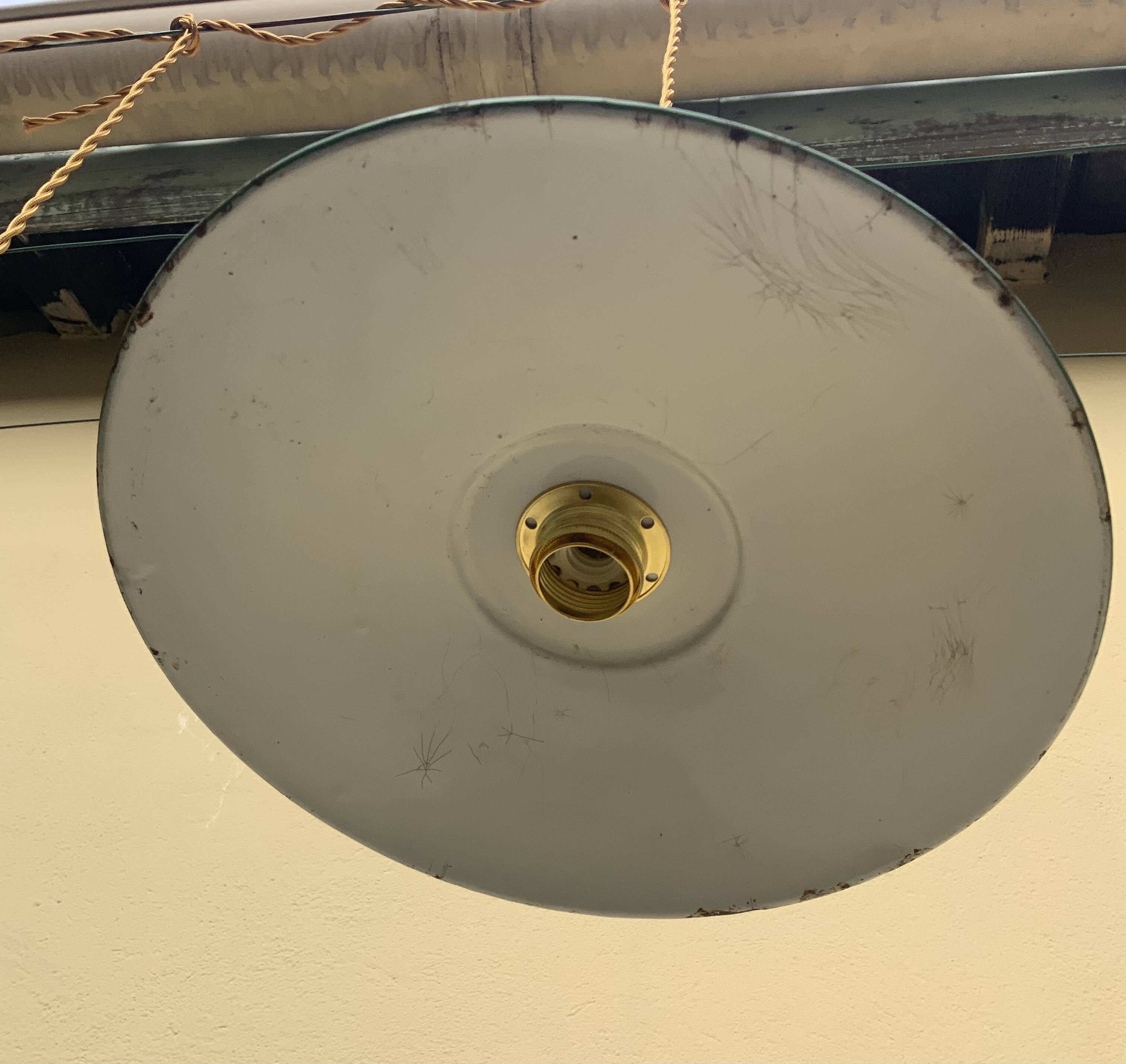 Vintage industrial enameled sheet metal pendant lights with golden wires, old green and white lampshade