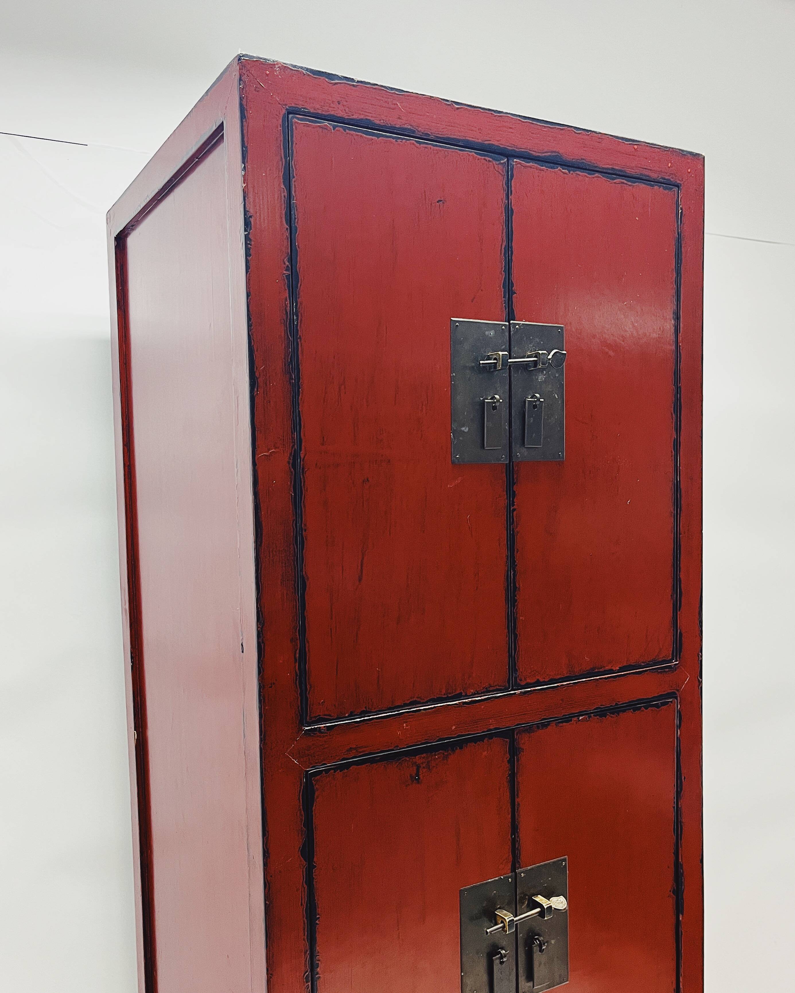 Red Chinese cabinet with three doors