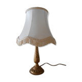 Lamp with brass foot and fringed lampshade