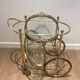 Oval brass trolley from Maison Baguès.