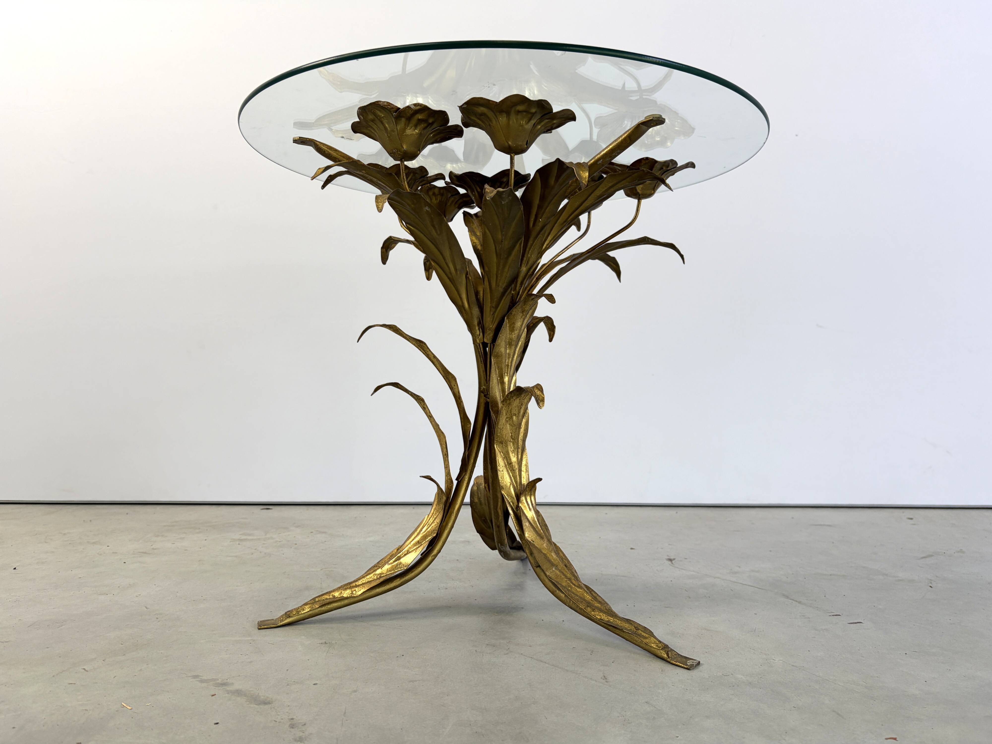 Charming metal flower coffee table or side table with a clear glass top. Made in Italy, attributed to Hans Kögl.