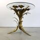 Charming metal flower coffee table or side table with a clear glass top. Made in Italy, attributed to Hans Kögl.