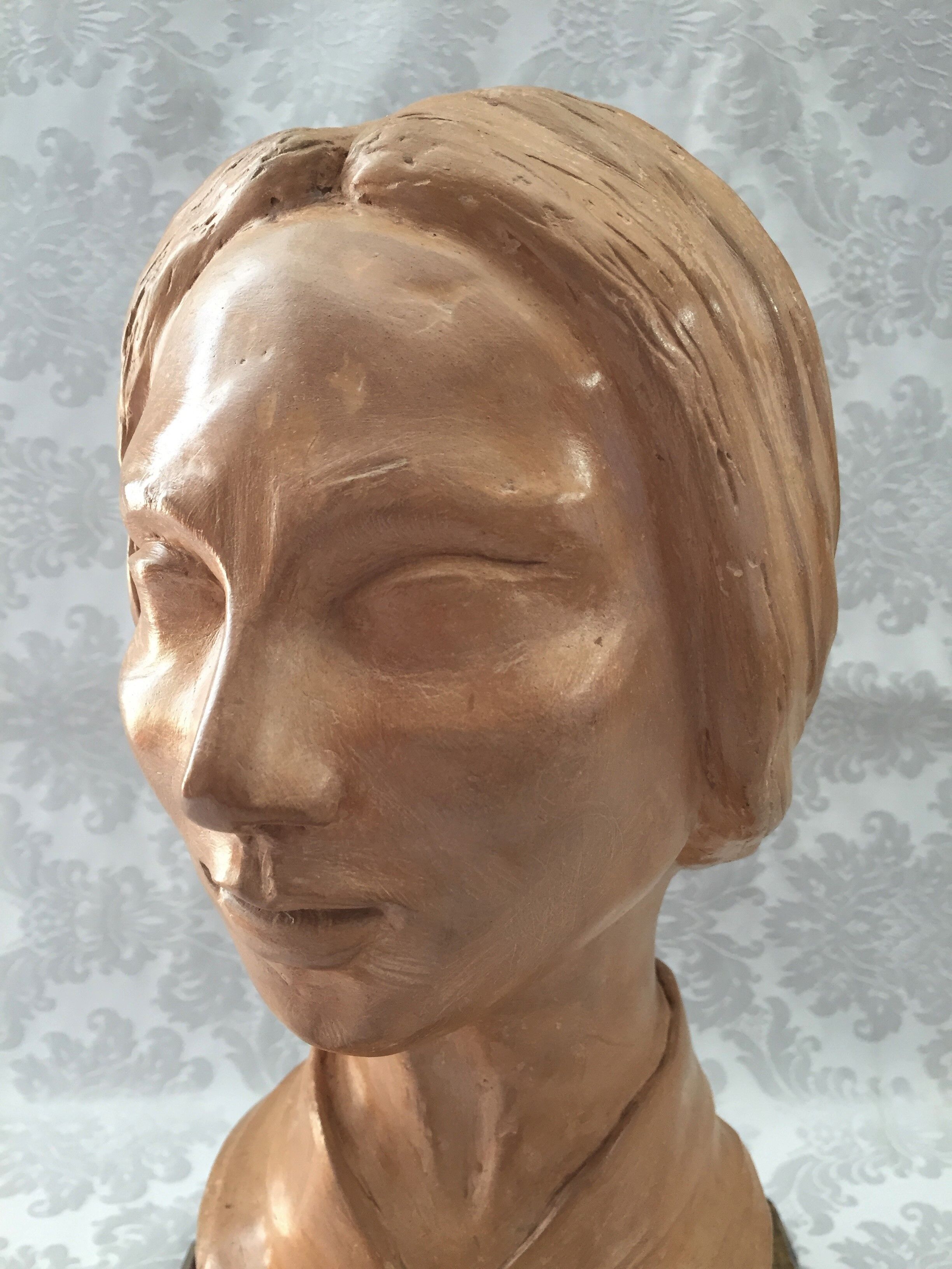 Bust in raw earth of atelier bust face of woman signed j.c.g.