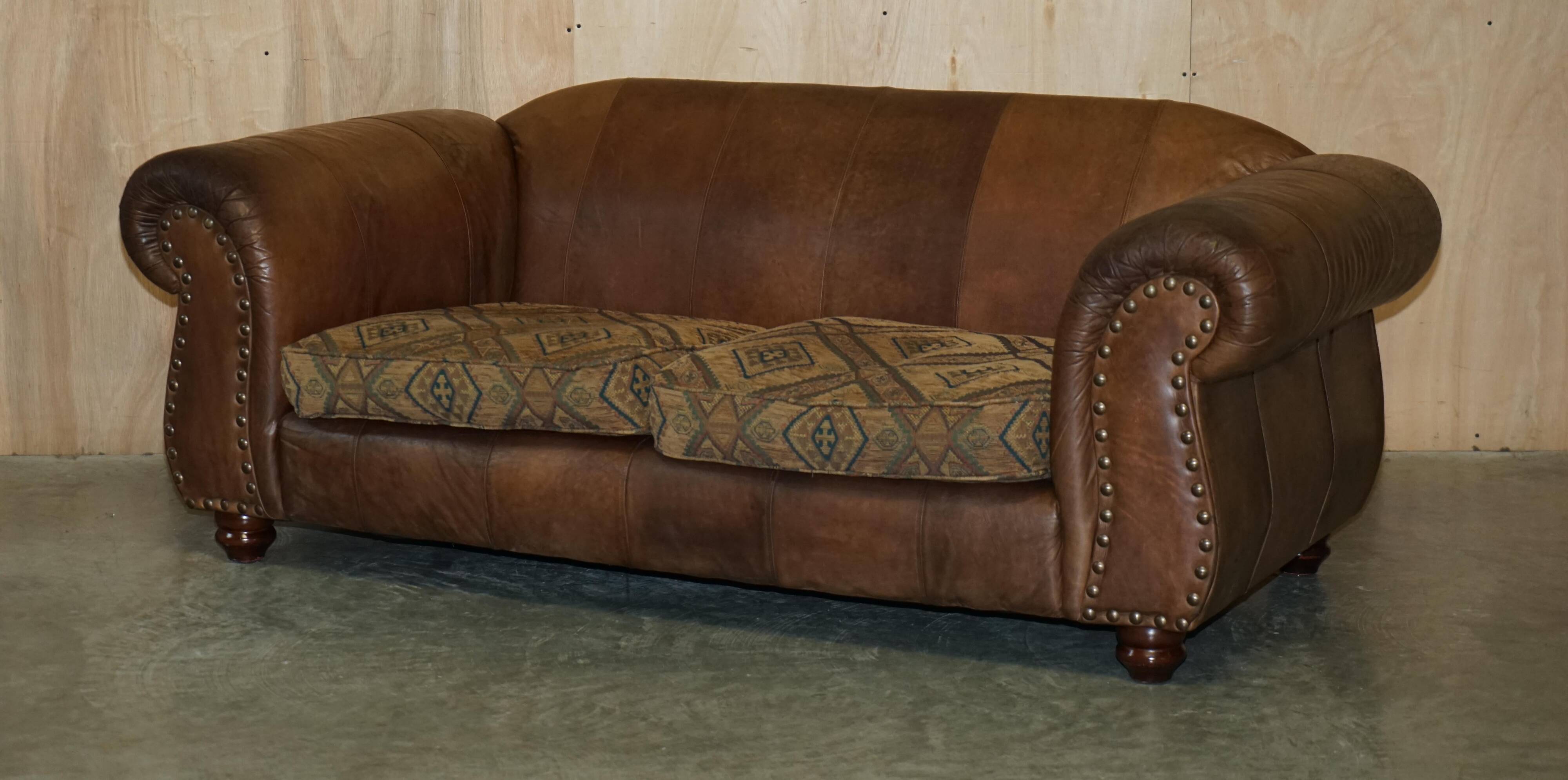 Vintage leather sofas by Thomas Lloyd with Kilim cushions.