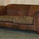 Vintage leather sofas by Thomas Lloyd with Kilim cushions.