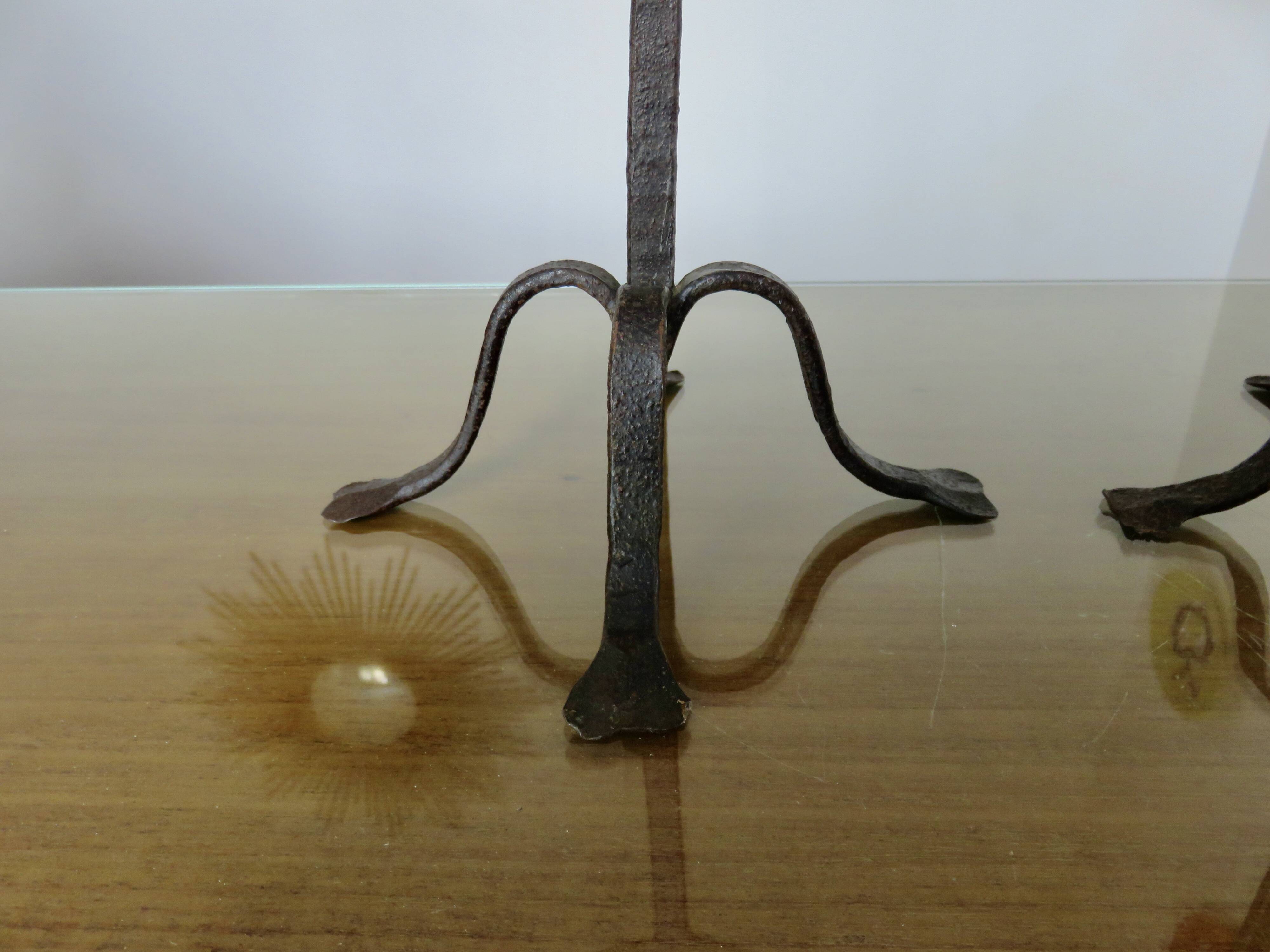 Pair of antique wrought iron candlesticks