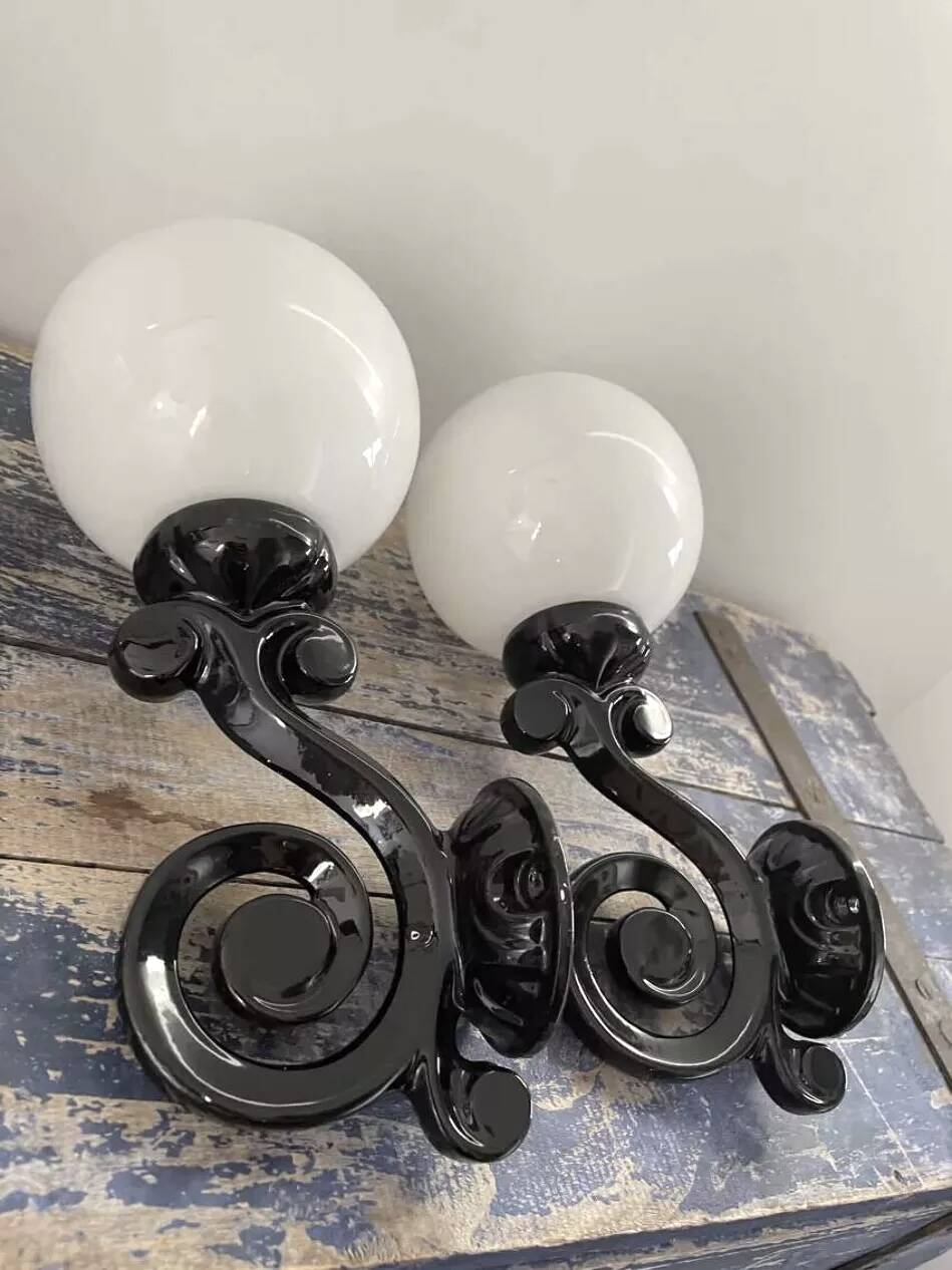 Pair of vintage enameled cast iron wall sconces