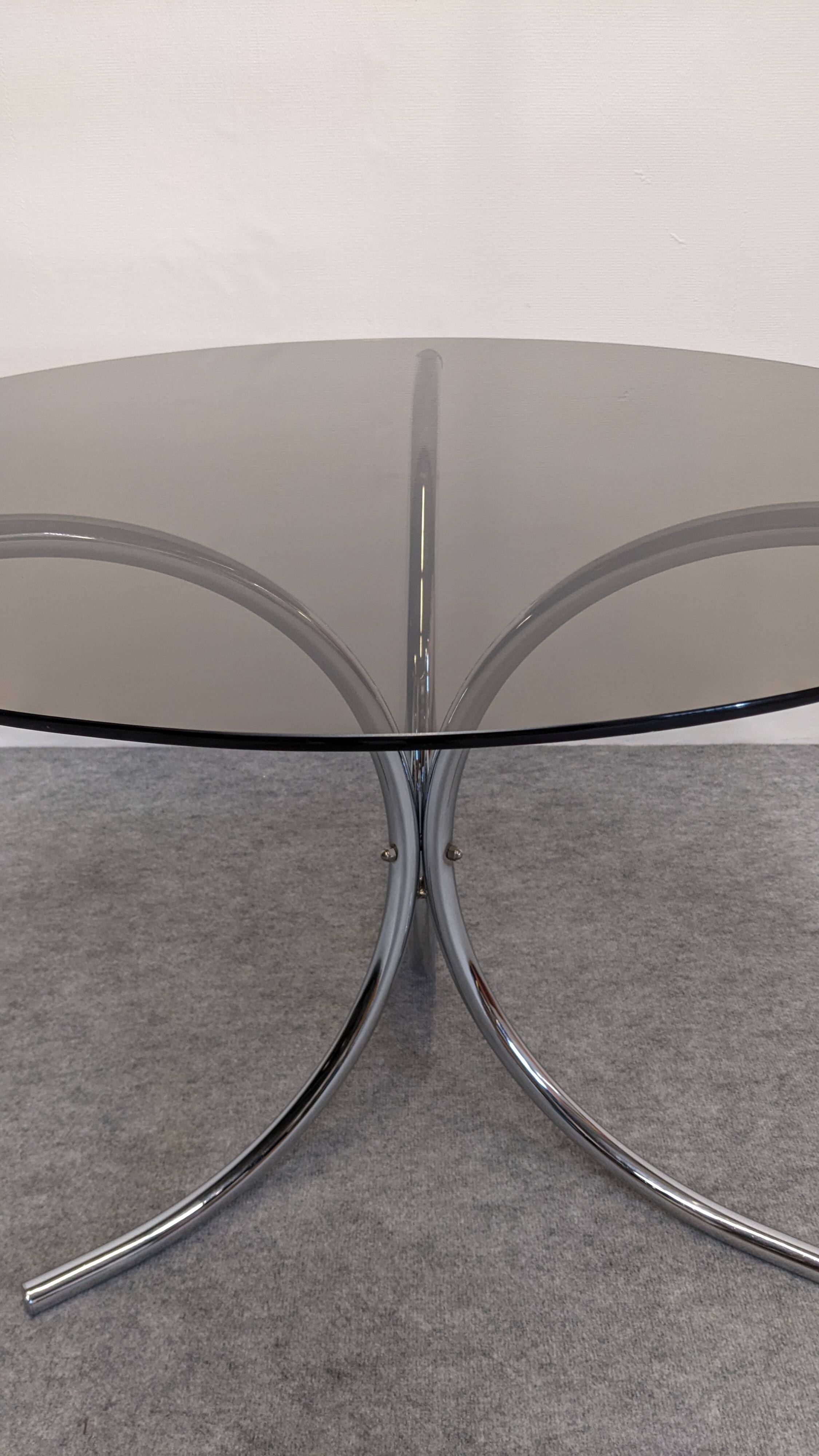 Chrome metal and smoked glass round table, Italy circa 1970.