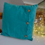 Scandinavian green cushion with wooden buttons