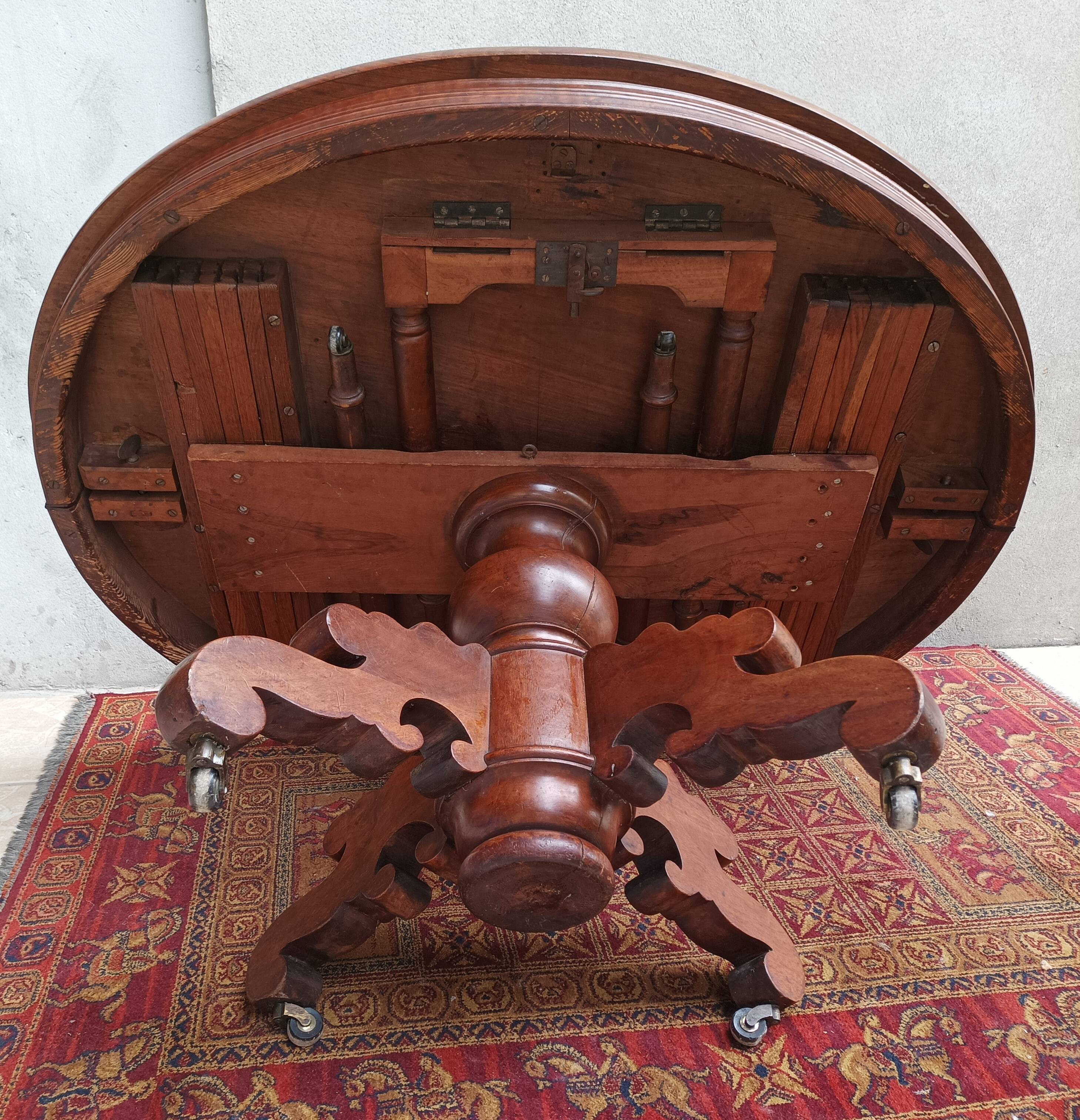 English oval table with 19th century mahogany extensions