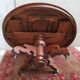 English oval table with 19th century mahogany extensions