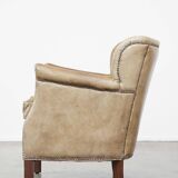 Nice, subtle cowhide armchair with a reversible kilim seat cushion