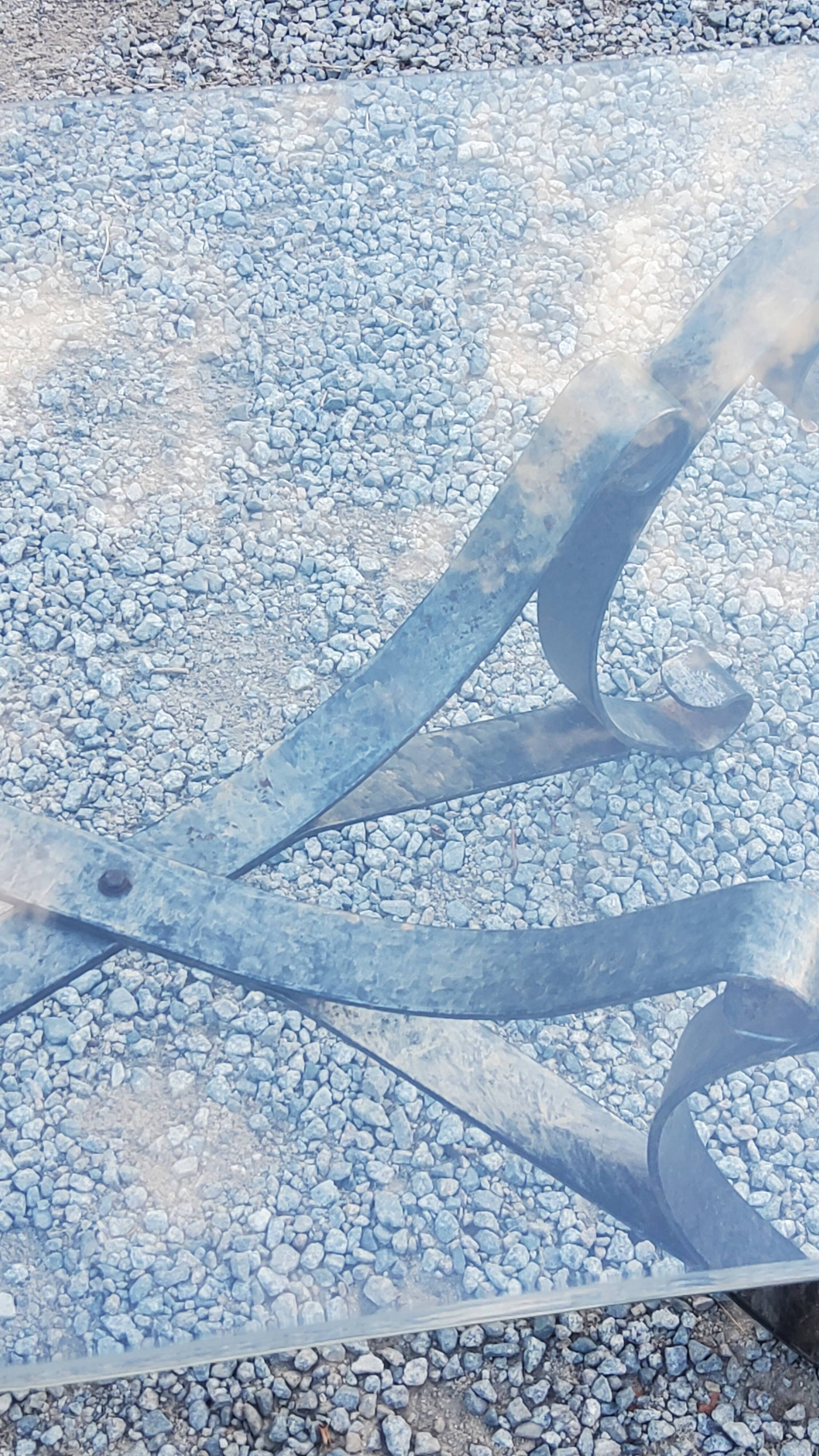 Coffee table from the 70s in wrought iron glass top bec de corbin