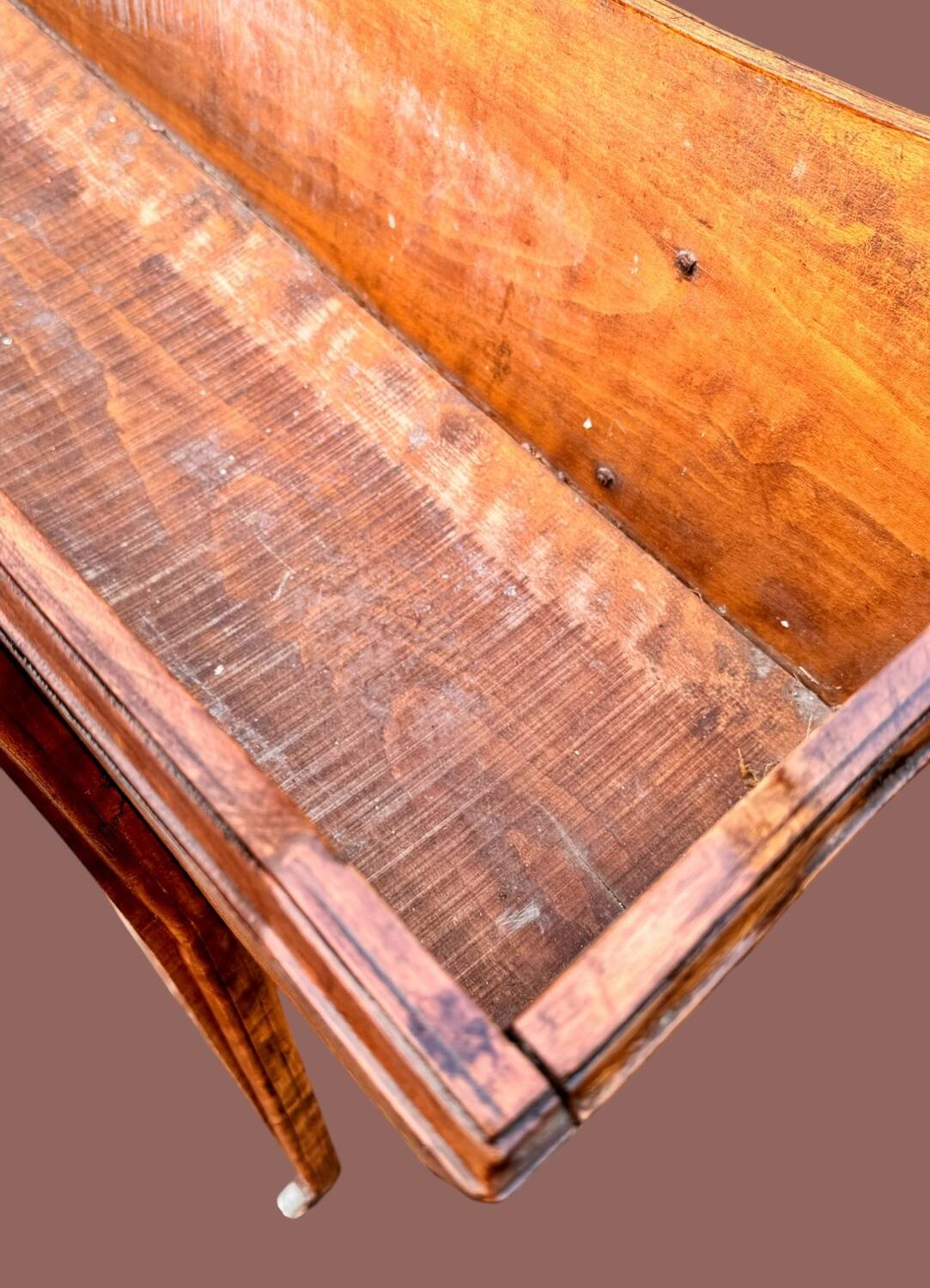 Old indoor planter on wheels