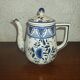 Henriot Quimper earthenware coffee set with floral decoration and elegant blue