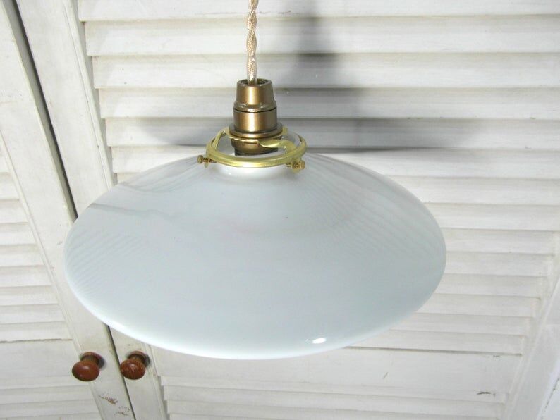 Hanging in opaque white glass.