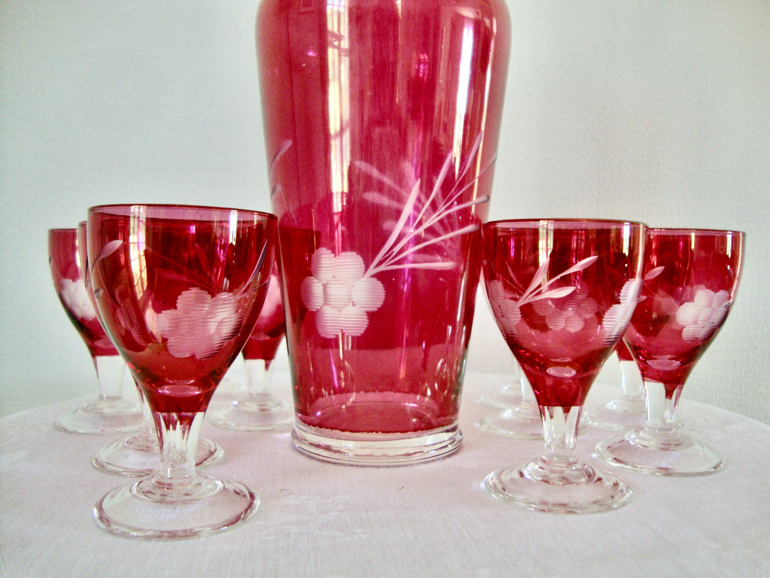 10 glasses and carafe with alcohol or liquor