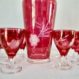 10 glasses and carafe with alcohol or liquor