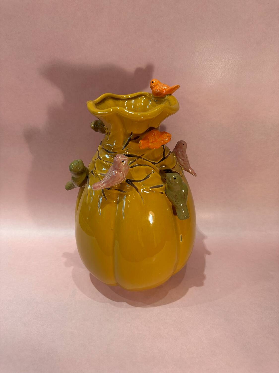 Yellow vase decorated with birds