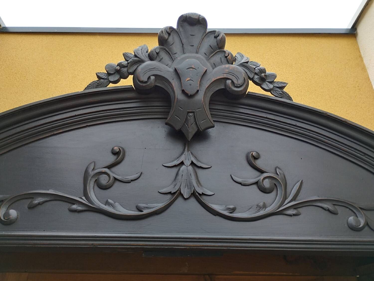 Bookcase black patina shell pediment 2 drawer doors
