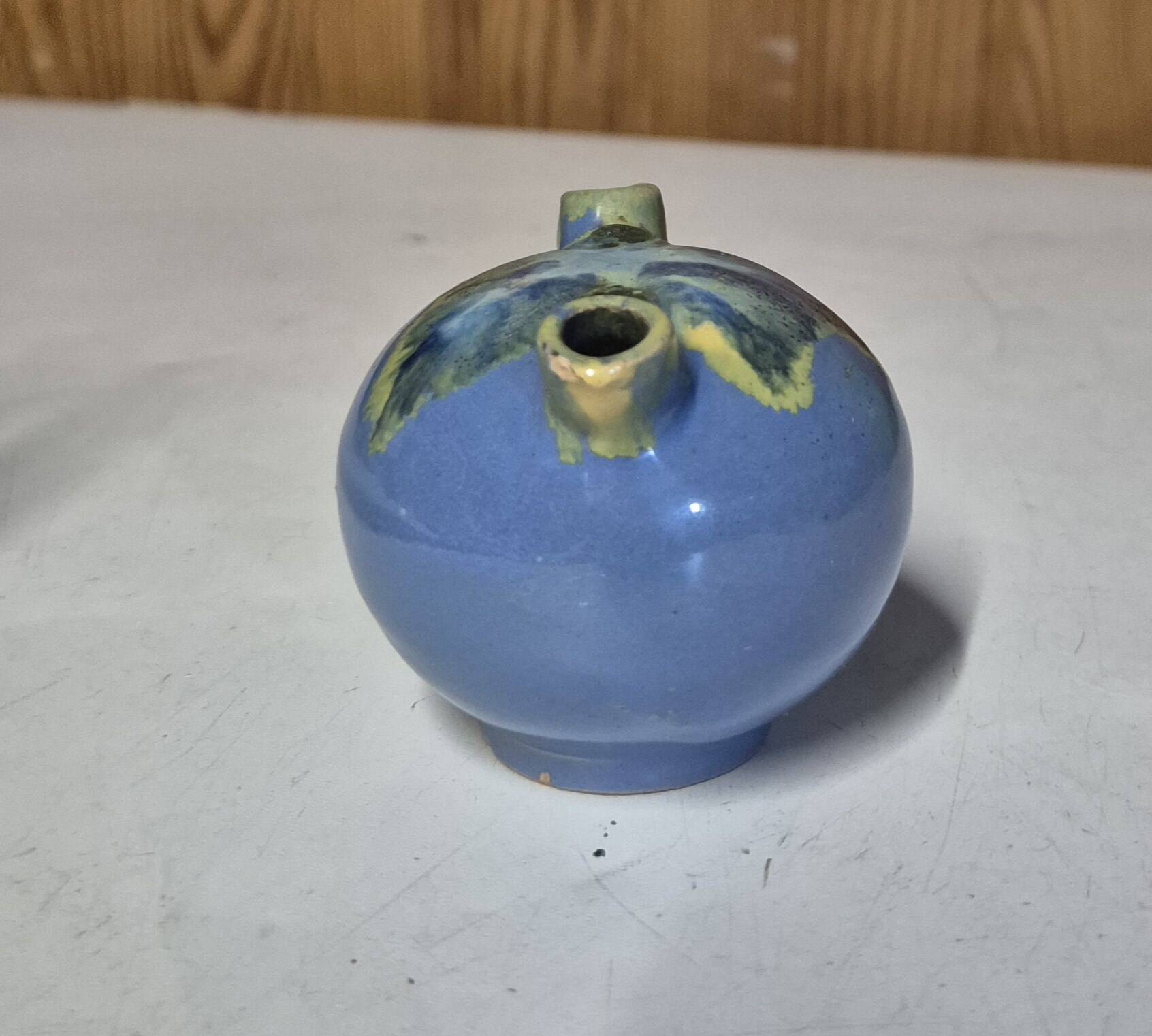 Glazed ceramic flower spike vase stamped "to be defined"
