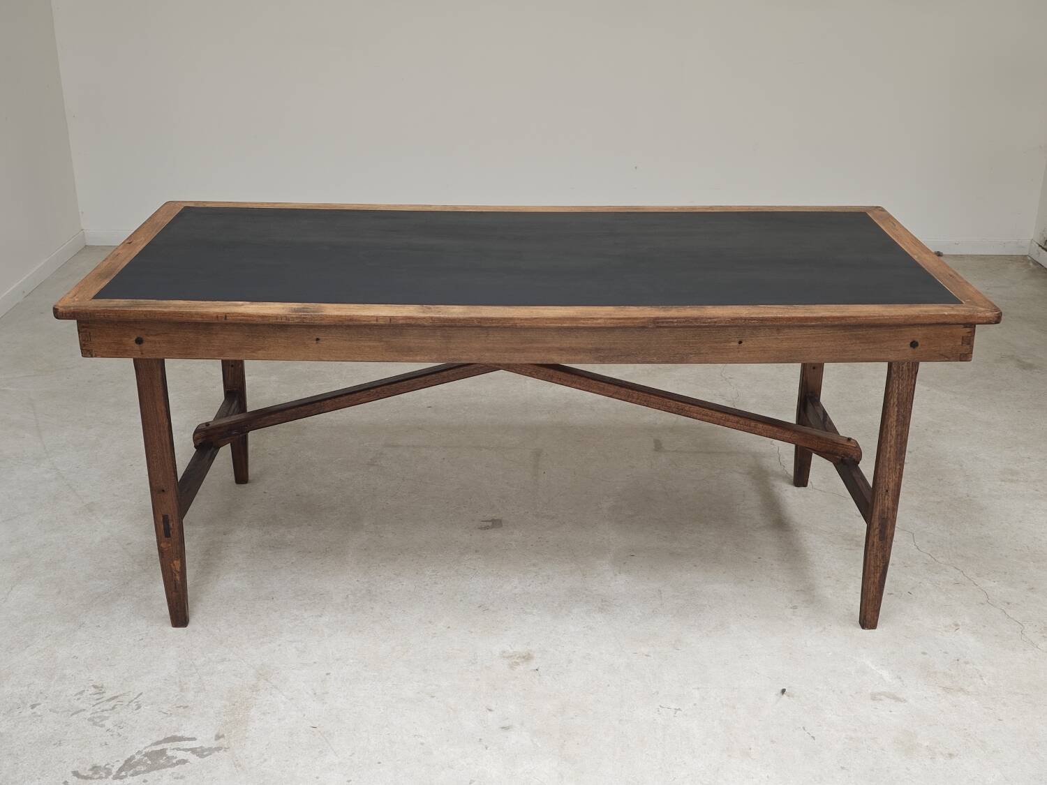 Vintage workshop folding table in oak with a hand-patinated black top.