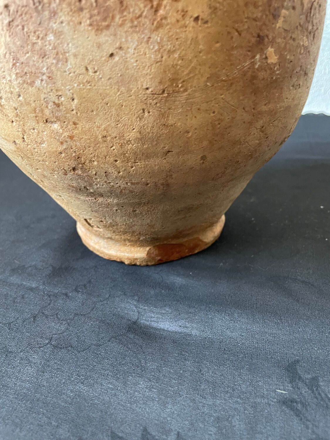 Old candied pot in yellow glazed terracotta