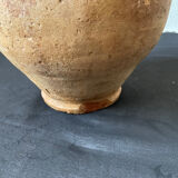 Old candied pot in yellow glazed terracotta